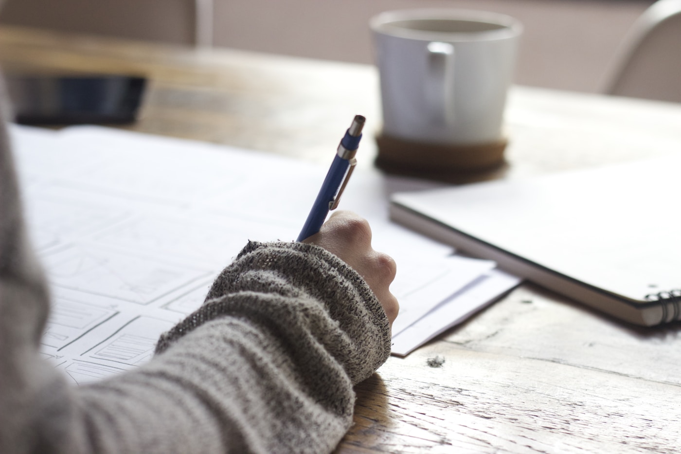 Open notebook and research materials arranged on a desk